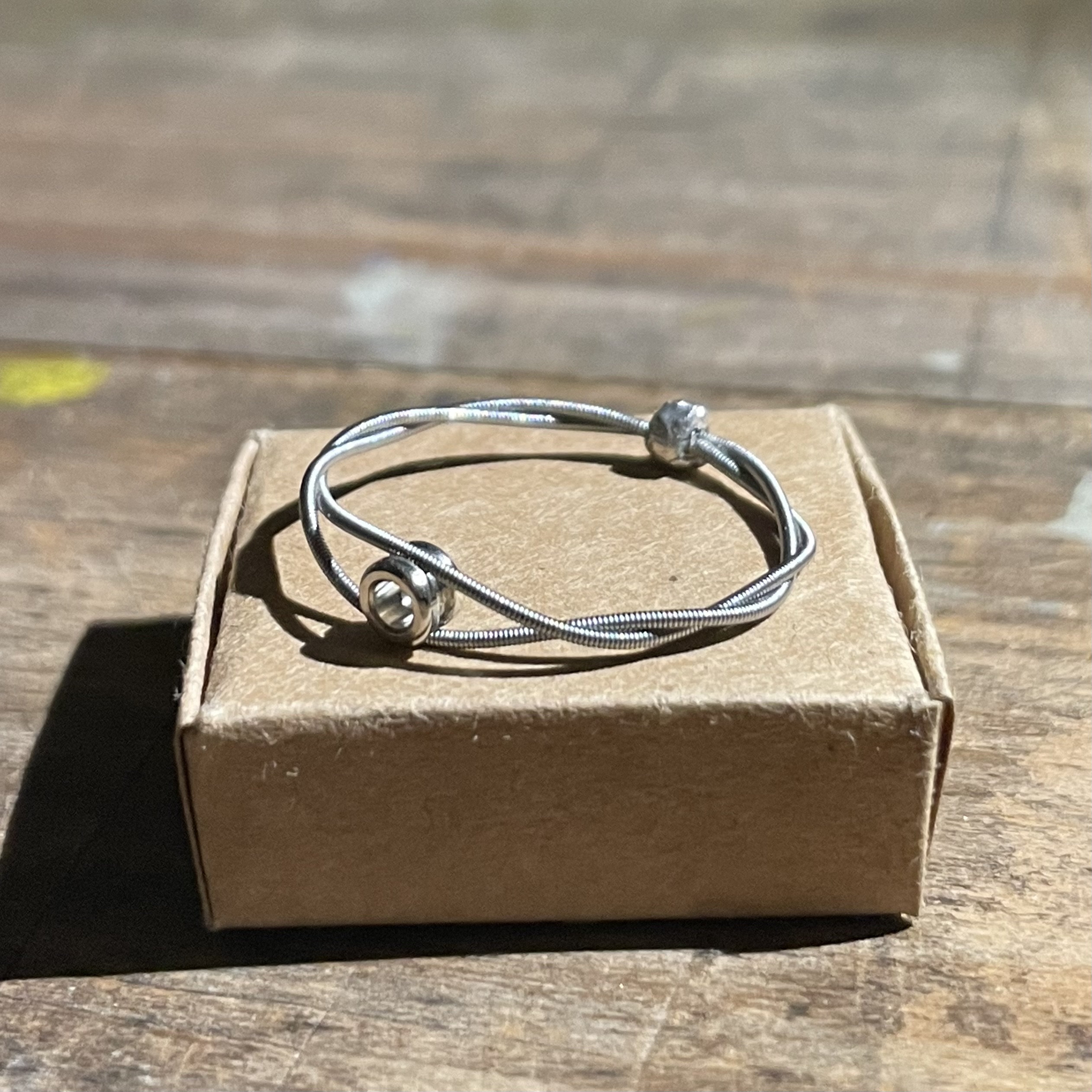 a silver ring with a ball end inserted