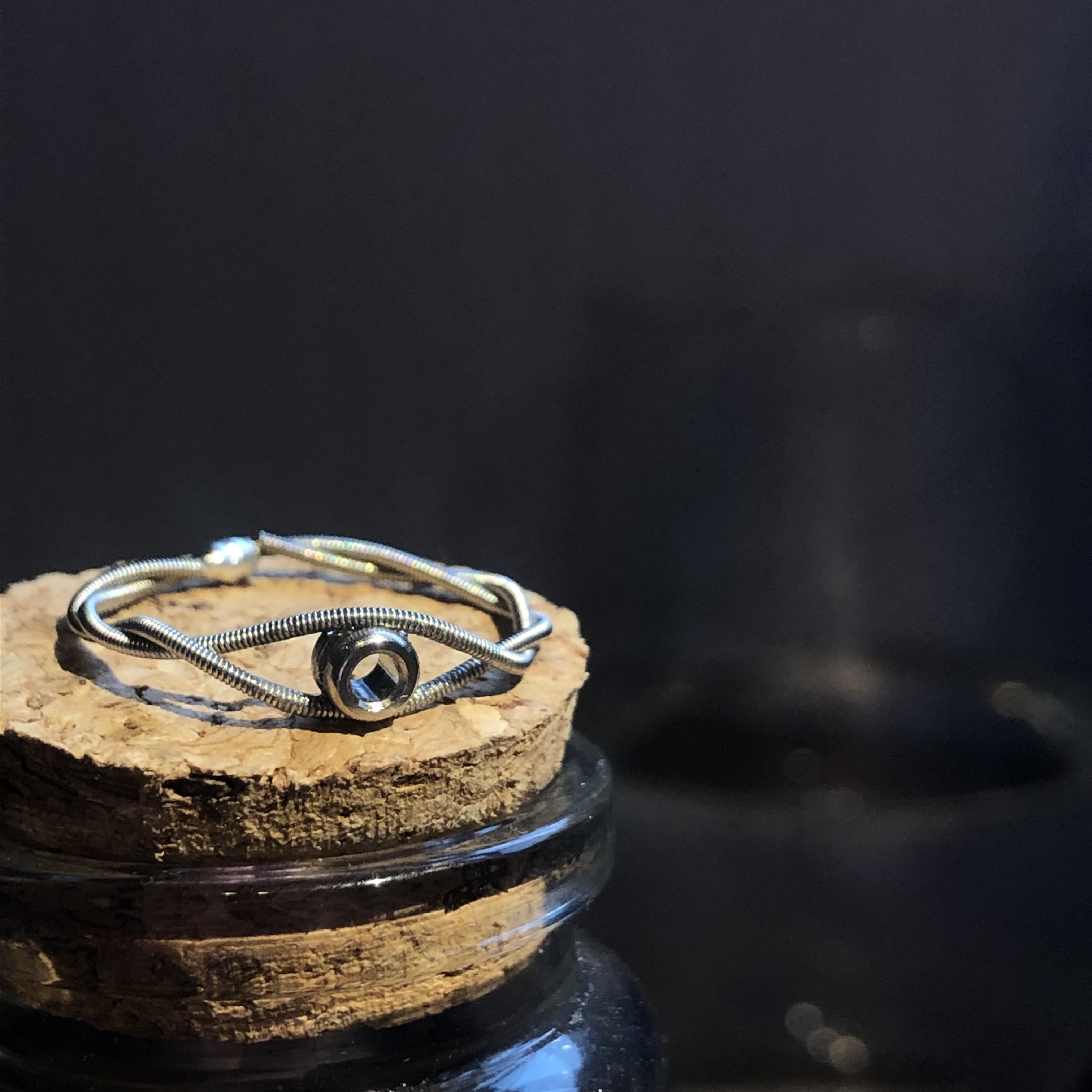 a silver ring with a ball end inserted